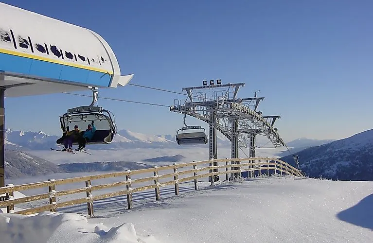 Winter on Katschberg: chairlift with a view of the snow-covered mountains between Carinthia and Salzburg