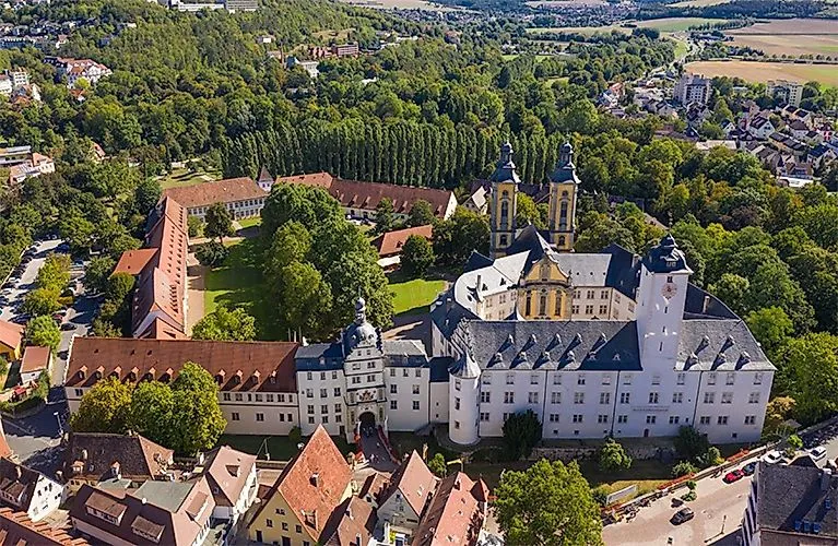 Aerial view of Bad Mergentheim Residential Palace, surrounded by green parks and old town buildings.